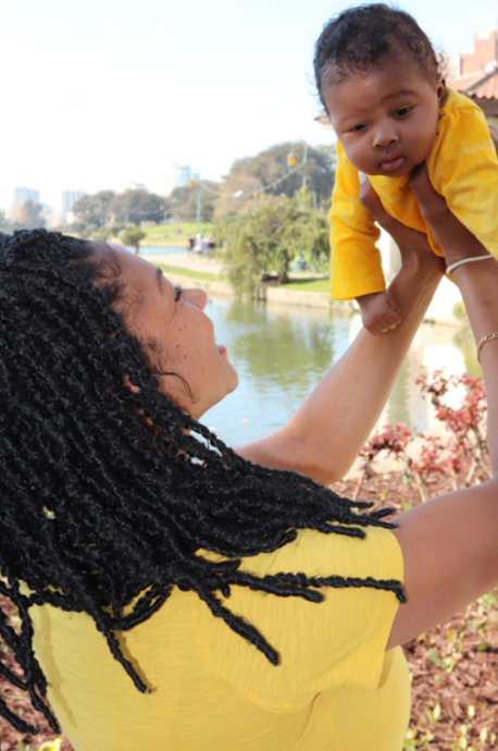 Black mother holding infant