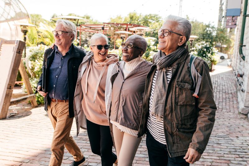 four older adults walking