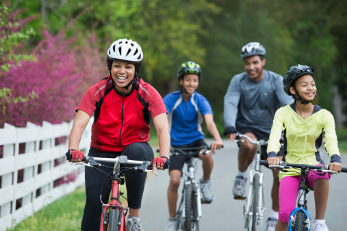 Family riding bikes together