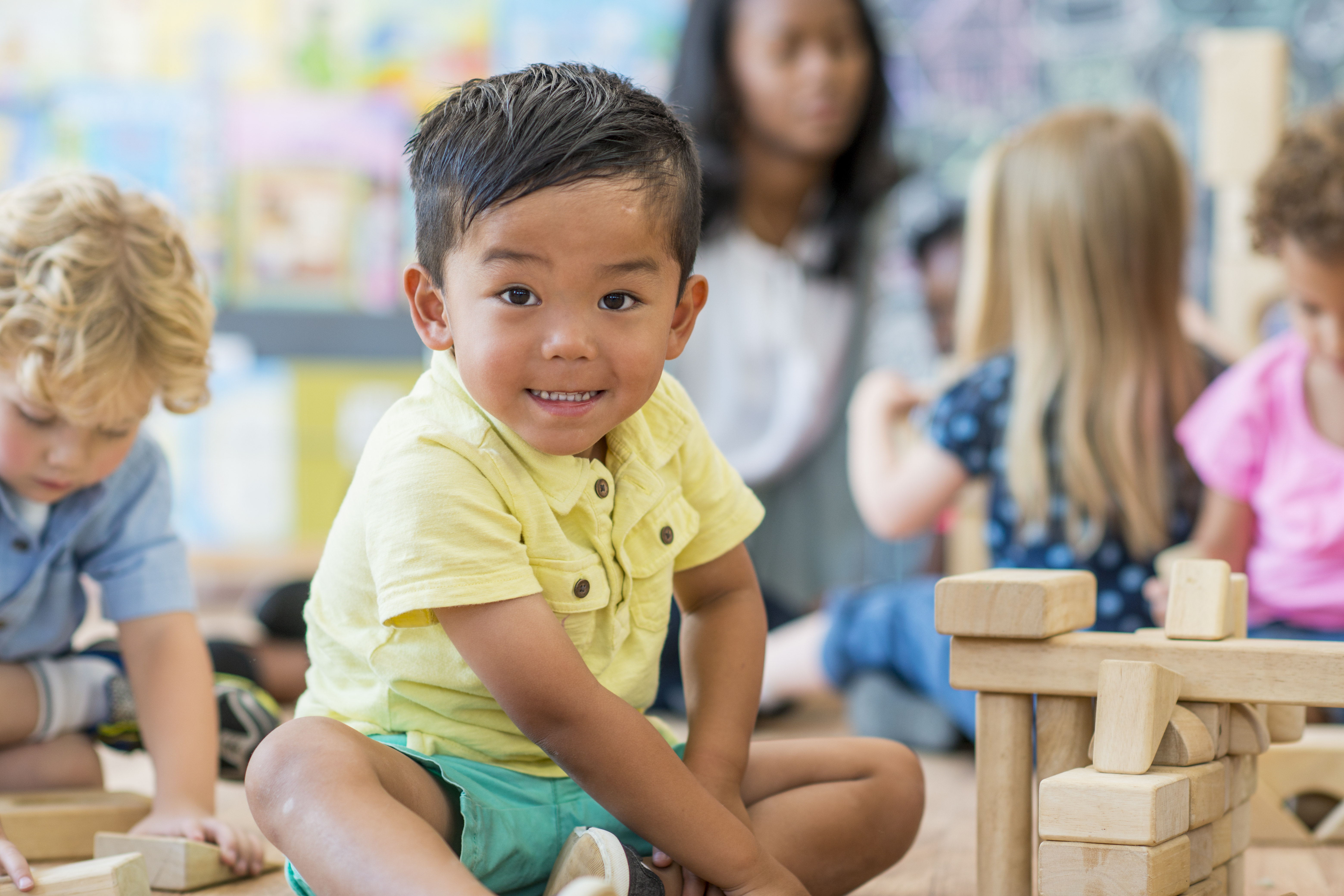 Child playing with blocks in preschool