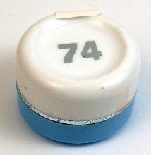 small round container of face cream with a blue cap and white body flipped upside down with the number 74 on the bottom
