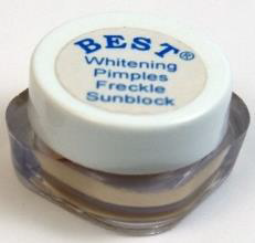 small round container of face cream with a clear body and white cap