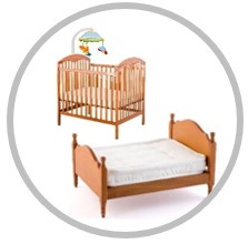 child's bed and baby crib
