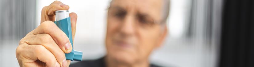 person holding inhaler