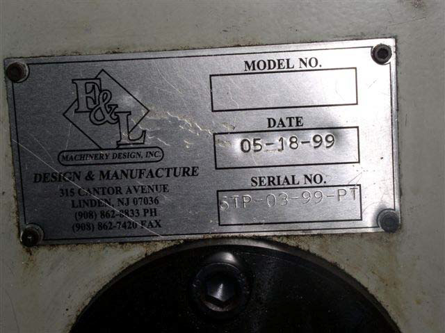 The metal name plate for the machine says F and L Machinery Design Inc. with an address in New Jersey. The date stamped on the plate is 5 18 99.