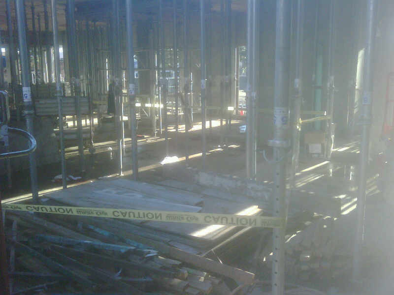 The vertical shoring support poles near where the victim fell through.