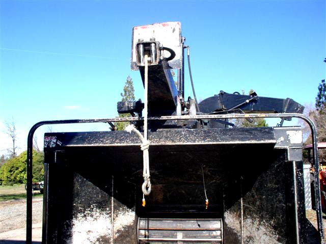 The rope winch on the wood chipper, showing where it snapped off.