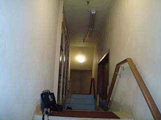 The narrow hallway leading to the stairs to the inside of the baptismal font.