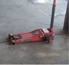 side view of a hydraulic jack on wheels