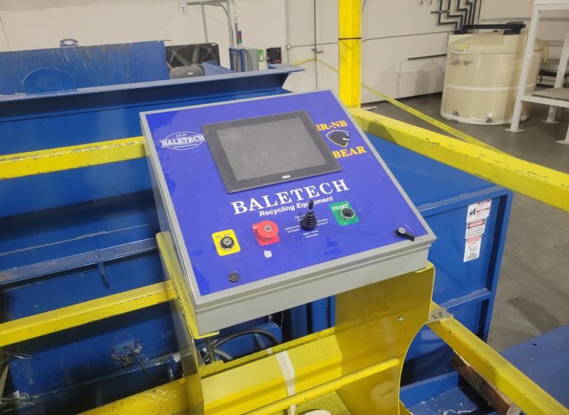 The reycling baler control panel with switch and emergency button