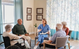 People sitting together at nursing facility.