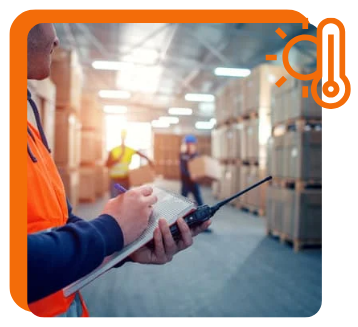 Supervisor in warehouse using  a checklist.