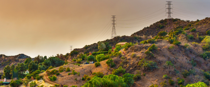 Canyon shrouded in smoke and haze during wildfires.