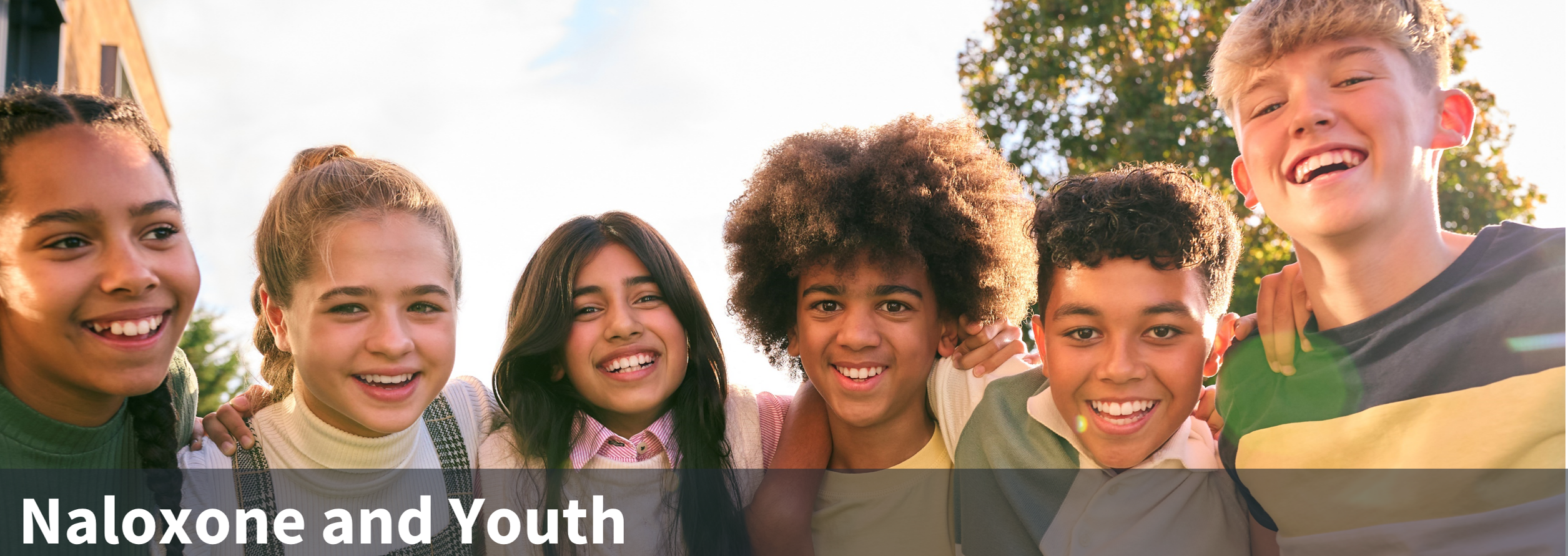 Youths smiling at the camera with the title Naloxone and Youth
