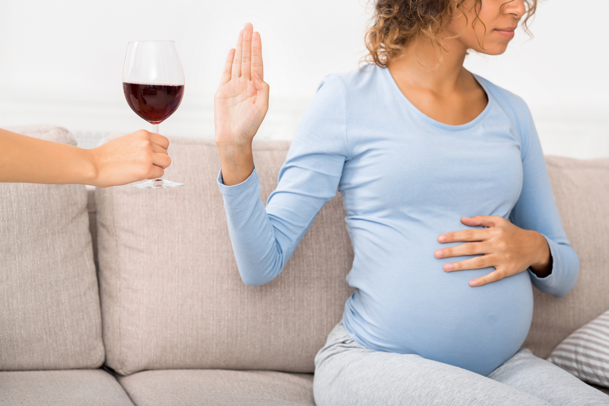 Pregnant woman refusing alcohol