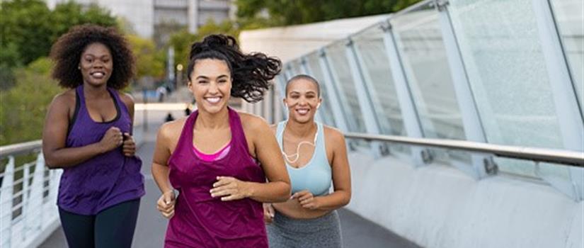 Group of young women jogging