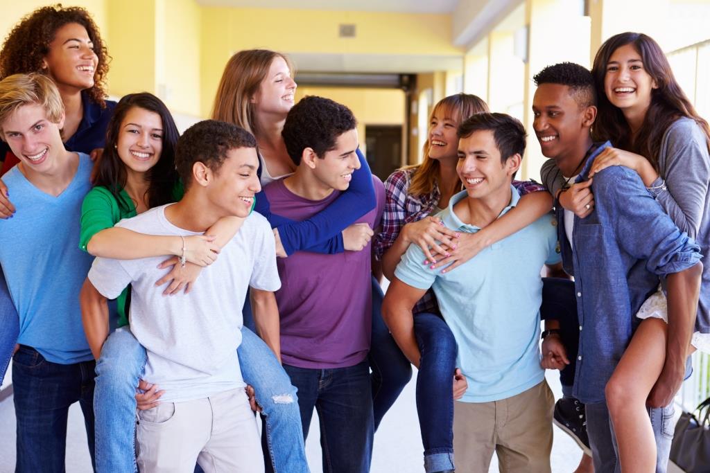 Group shot of teens ages 14-17 in school hallway