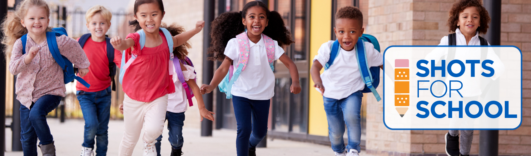 children running with backpacks on their backs