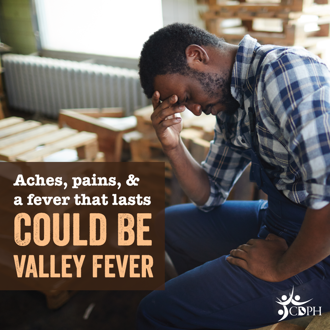 Aches, pains, and a fever that lasts could be Valley fever. Exhausted man holding his head.