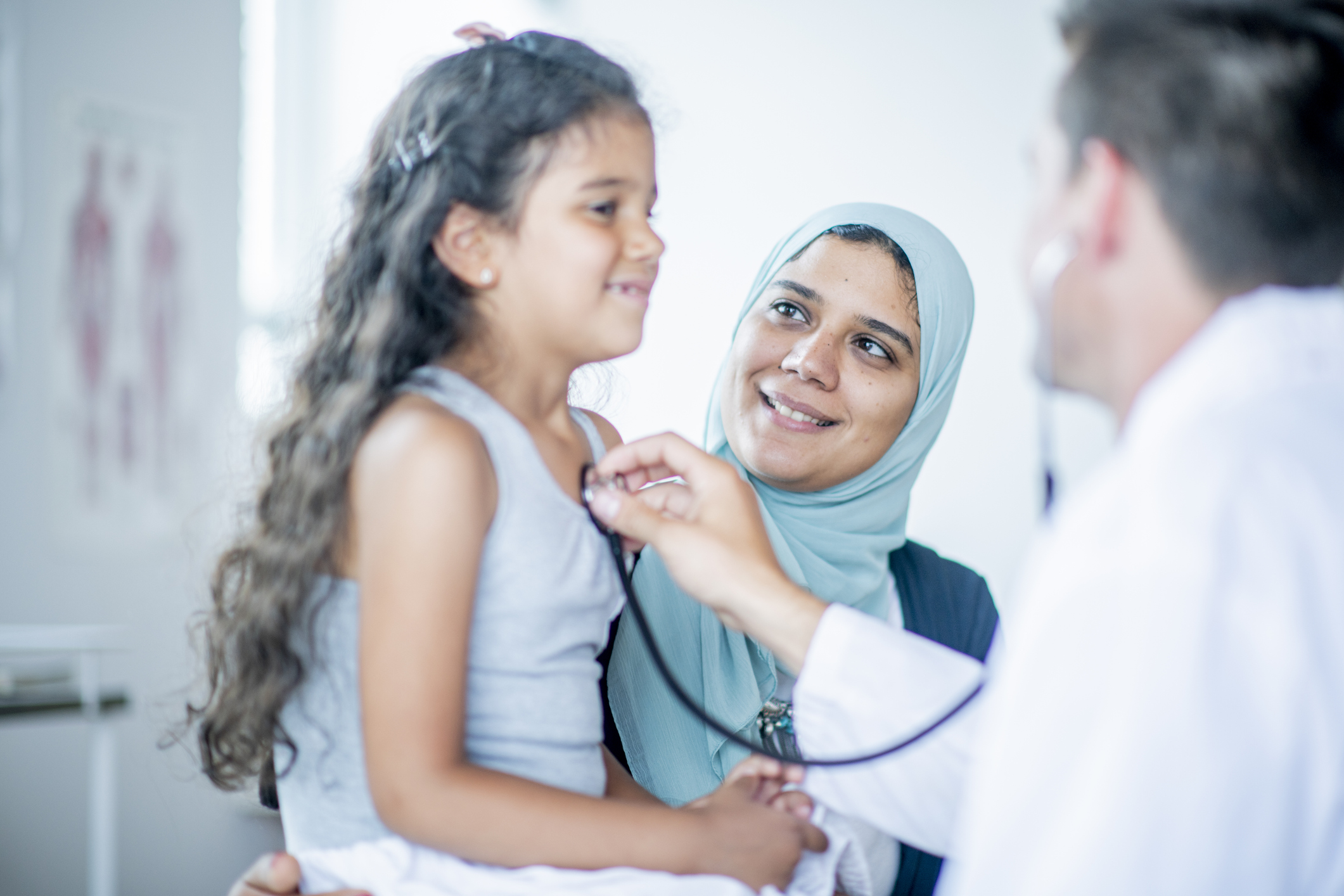 Child receiving health assessment