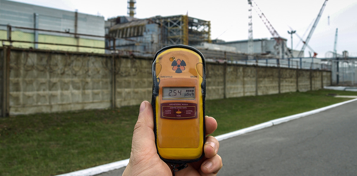 Man holding a Geiger Counter