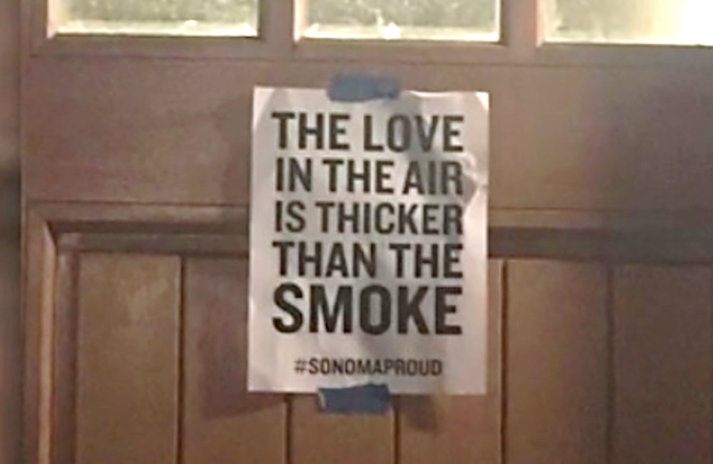 Sign showing "The Love in the air is thicker than the smoke"