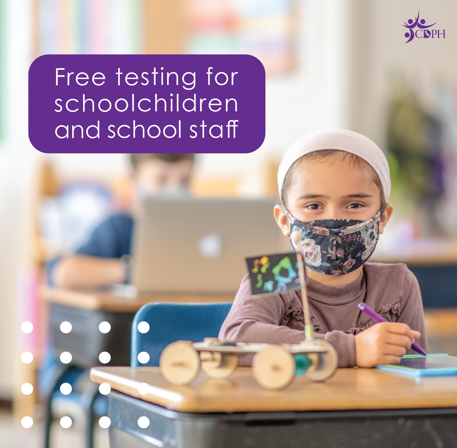 Student with mask in classroom with text overlay "Free testing for schoolchildren and school staff"