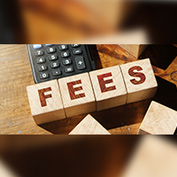 Wood blocks with FEES spelled out and a calculator.