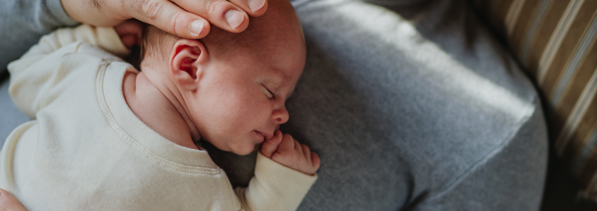 Baby laying on chest.
