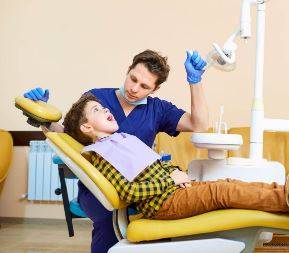 child in dentist chair child in dentist chair