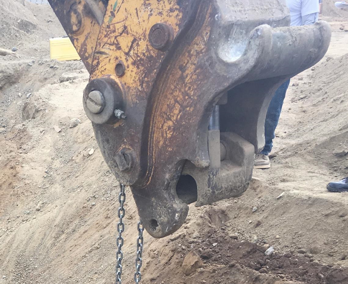 close-up of a quick coupler attached to the head of a boom close-up of a quick coupler attached to the head of a boom