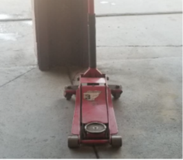 rear view of a hydraulic jack with wheels rear view of a hydraulic jack with wheels