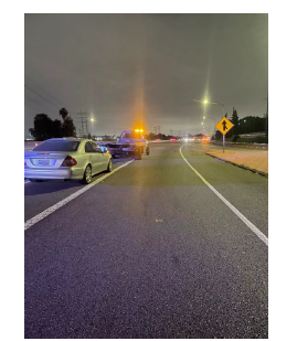 The tow truck partially in the southbound on ramp.