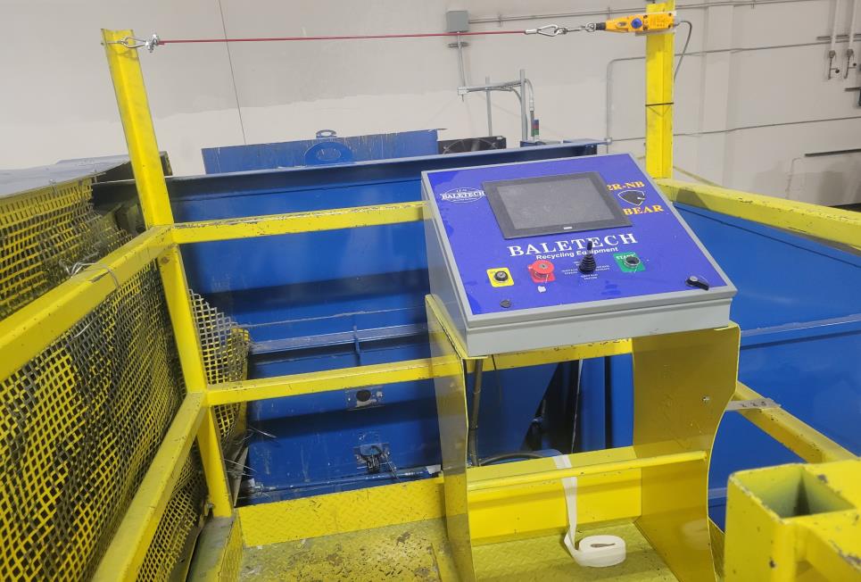 Yellow barrier around the control panel, the hopper, safety barrier and red cable. Yellow barrier around the control panel, the hopper, safety barrier and red cable.