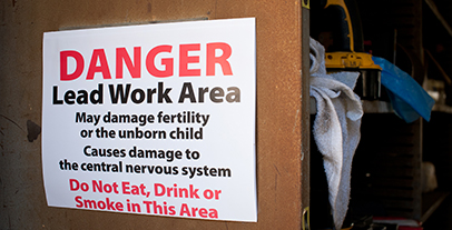 Lead Warning Sign (folded) haning in the lead work area